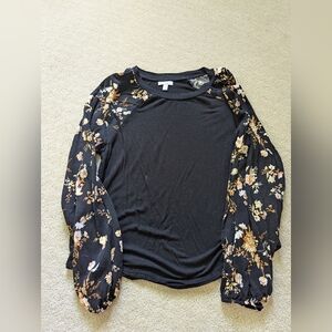 Black blouse with leaf print sleeves